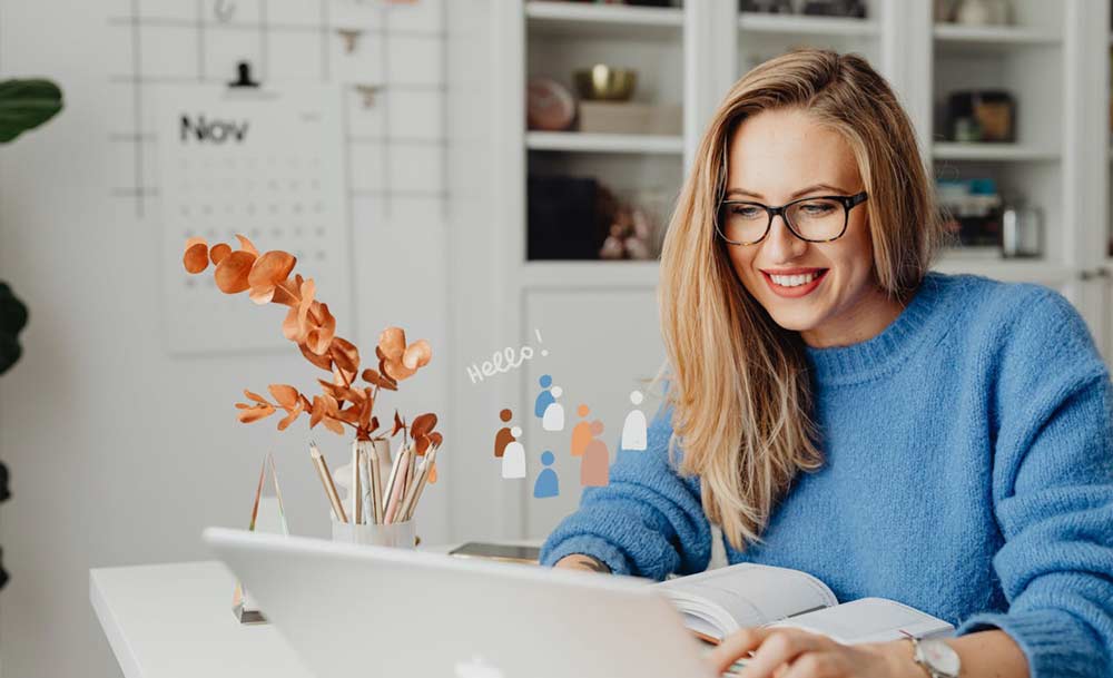 an virtual assistant in Blue Sweater Using a Laptop